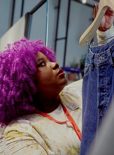 A female store employee changing a window display