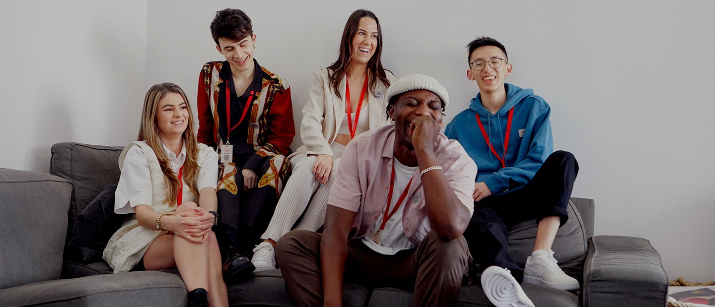 Group of store employees looking at the camera smiling