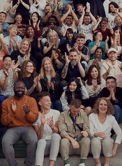 A large group of people together clapping