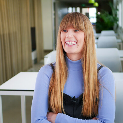 Female smiling and looking off camera